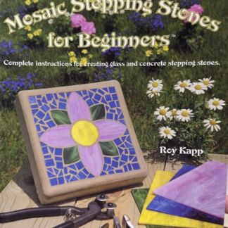 Book cover for Mosaic Stepping Stones for Beginners featuring a tile flower stepping stone, gardening tools, and colorful tiles on a wooden table in a garden.