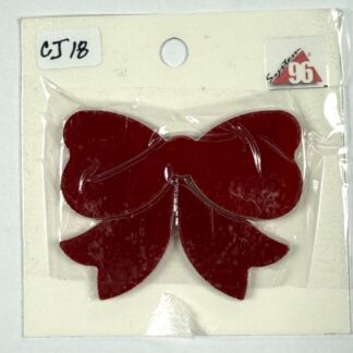 Red velvet bow hair accessory in packaging labeled CJ18 on a white card. Note: cosmetic/small craft item for styling hair.